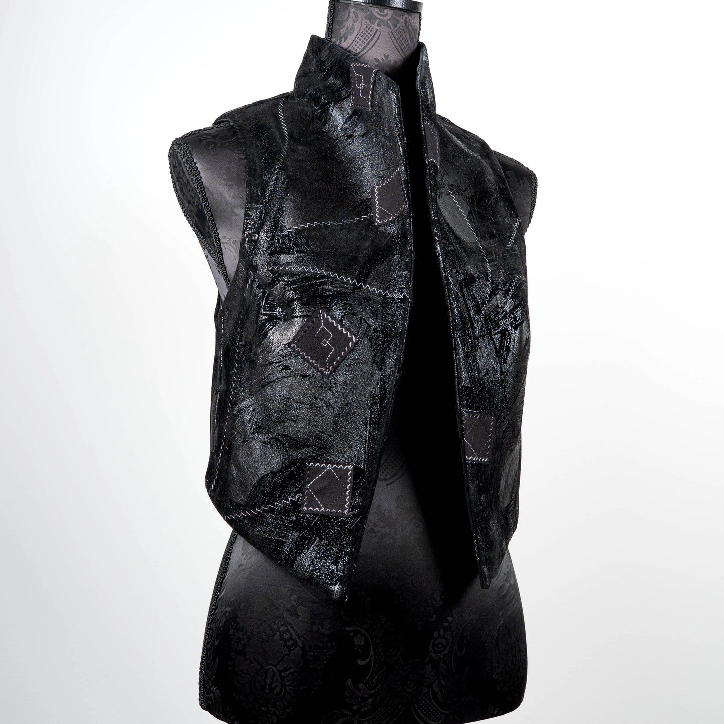Black vest in faux leather and suede with over stitching and patches limited edition gothic style handmade in Melbourne Eloise the label