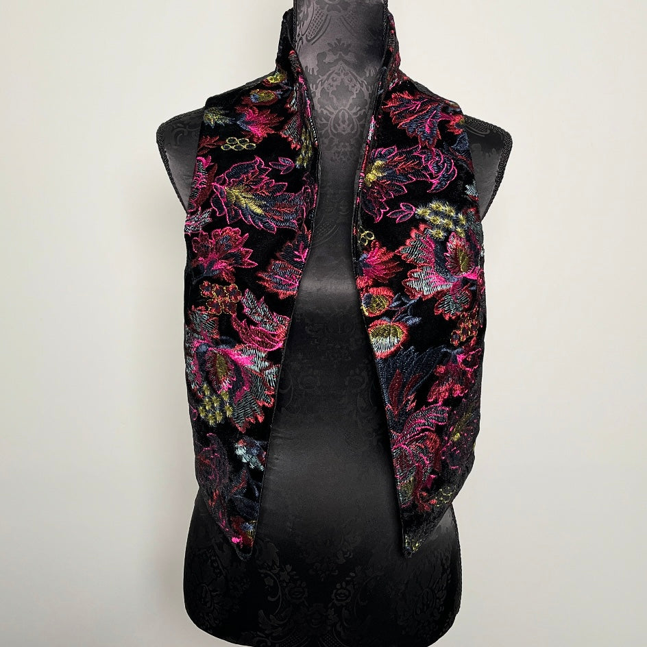 Black vest with colorful floral pattern embroidered on black velvet
