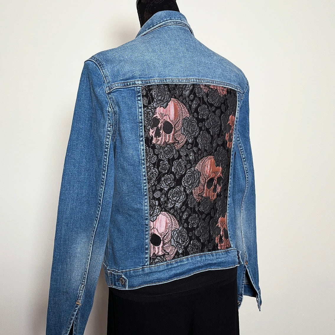 Upcycled blue denim jacket with skulls and roses in pink sustainable fashion melbourne made