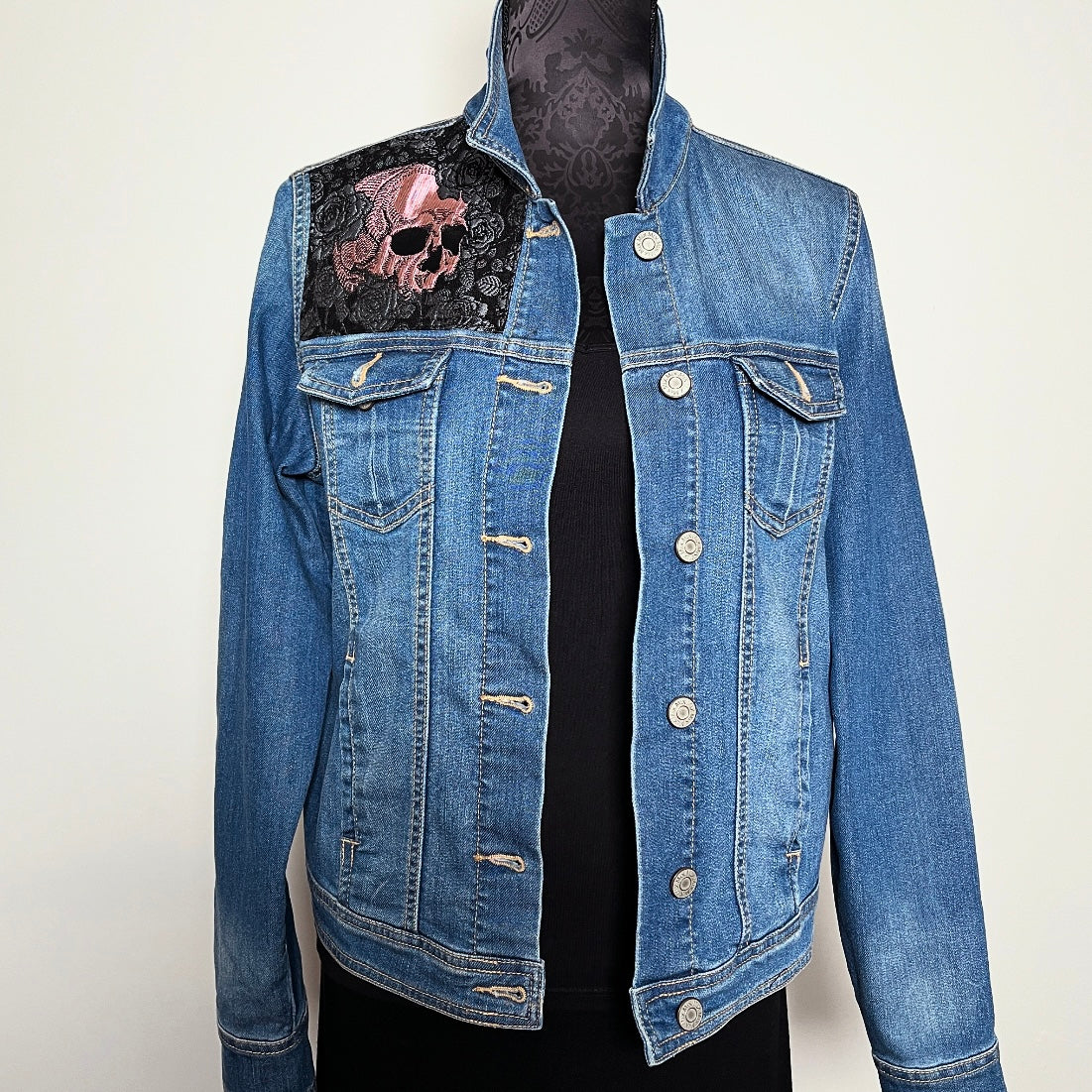Upcycled blue denim jacket with skulls and roses in pink sustainable fashion melbourne made