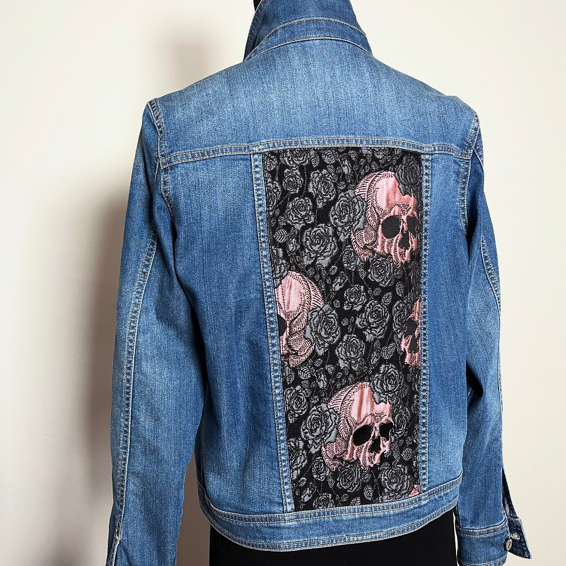 Upcycled blue denim jacket with skulls and roses in pink sustainable fashion melbourne made