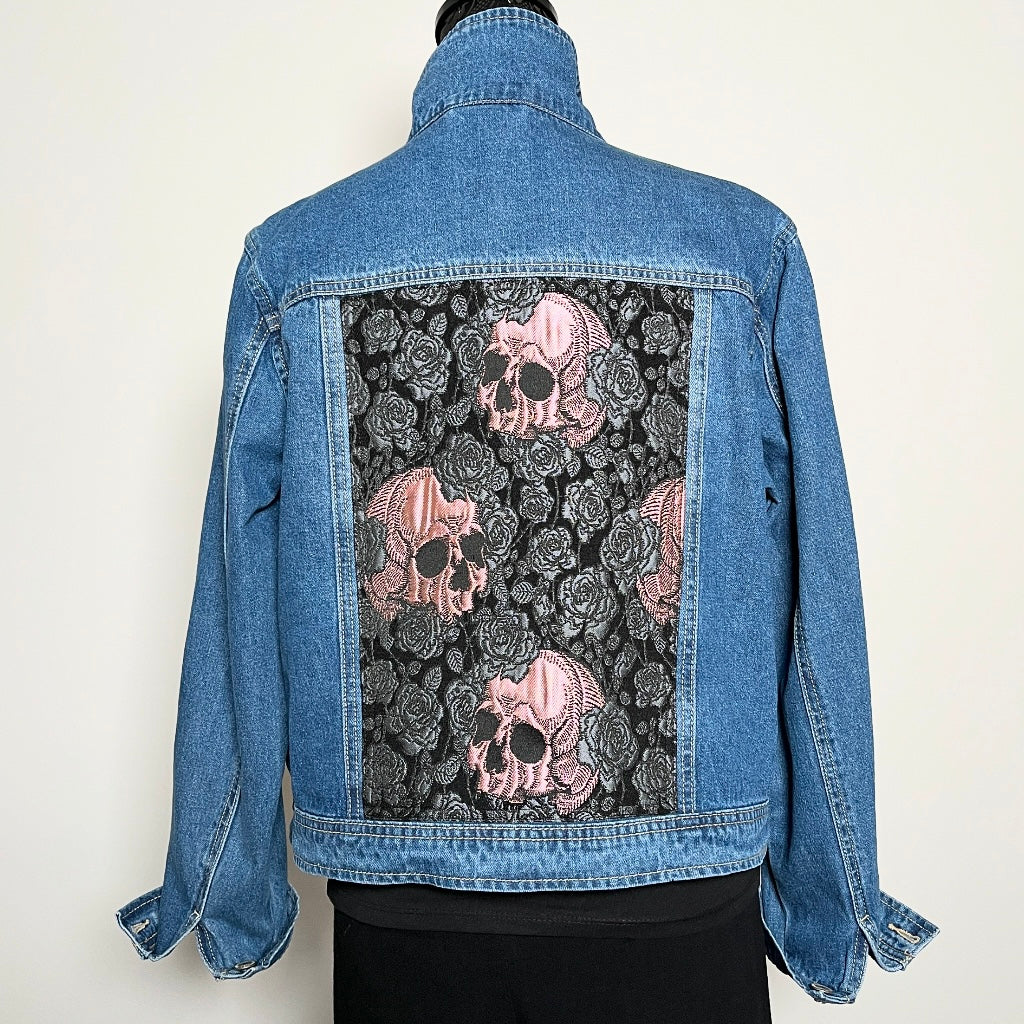 Upcycled blue denim jacket with skulls and roses in pink sustainable fashion melbourne made