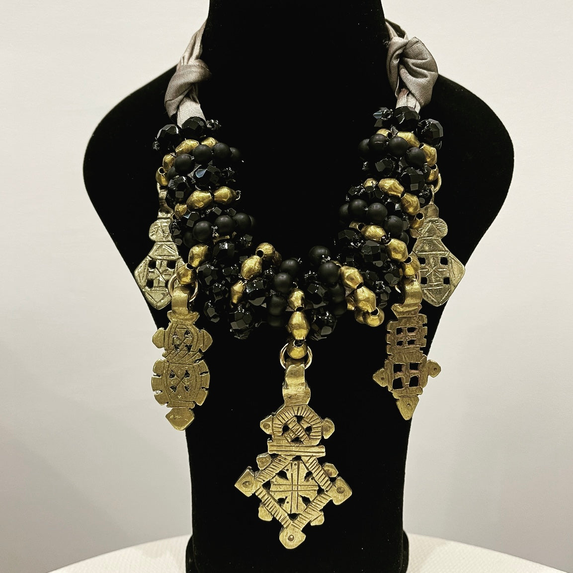 Angela Clark Bullets To Beauty Cross Necklace in gold tone