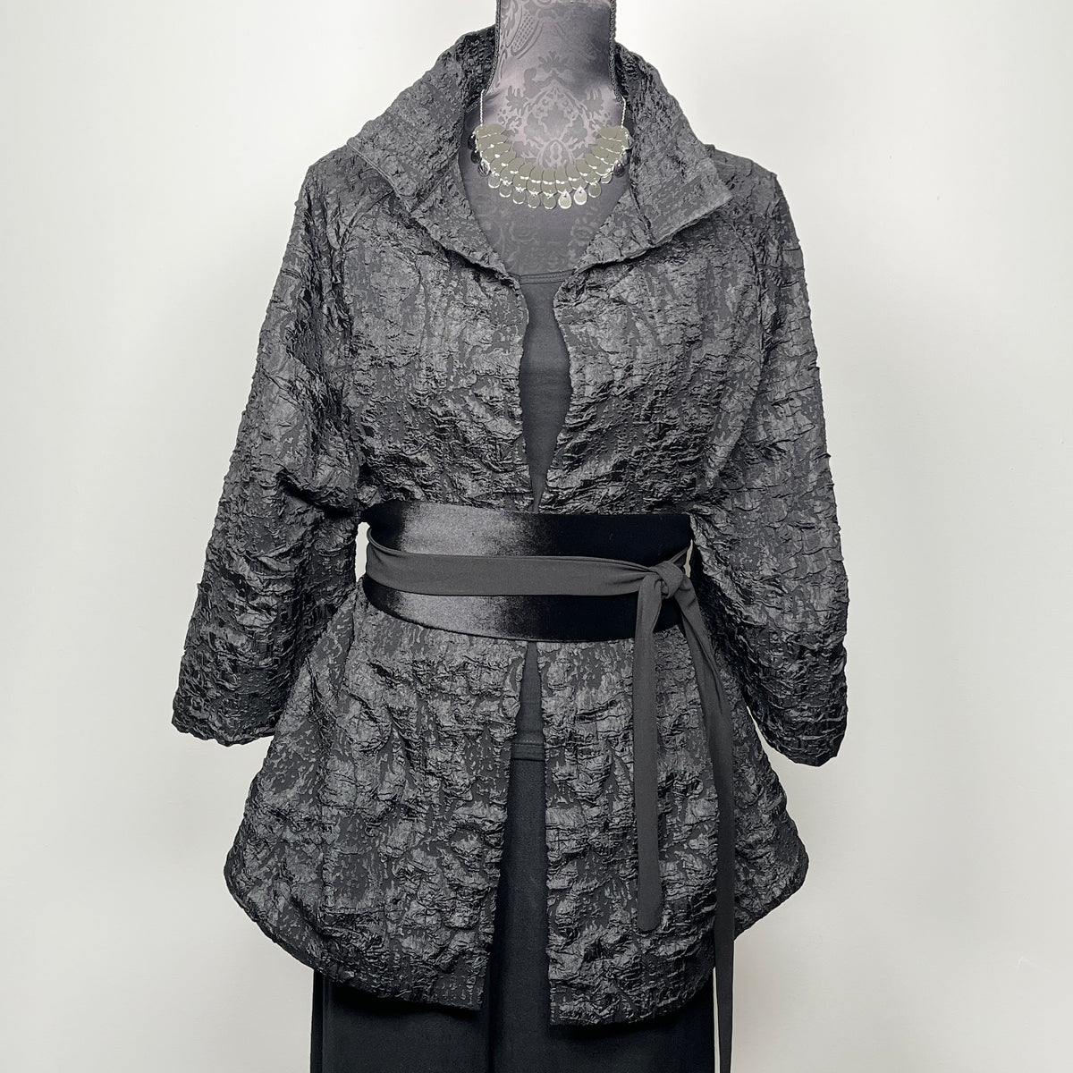 Gothic style black crinkle jacquard coat with high stand up collar evening coat chunky silver statement necklace made in Melbourne Eloise the label