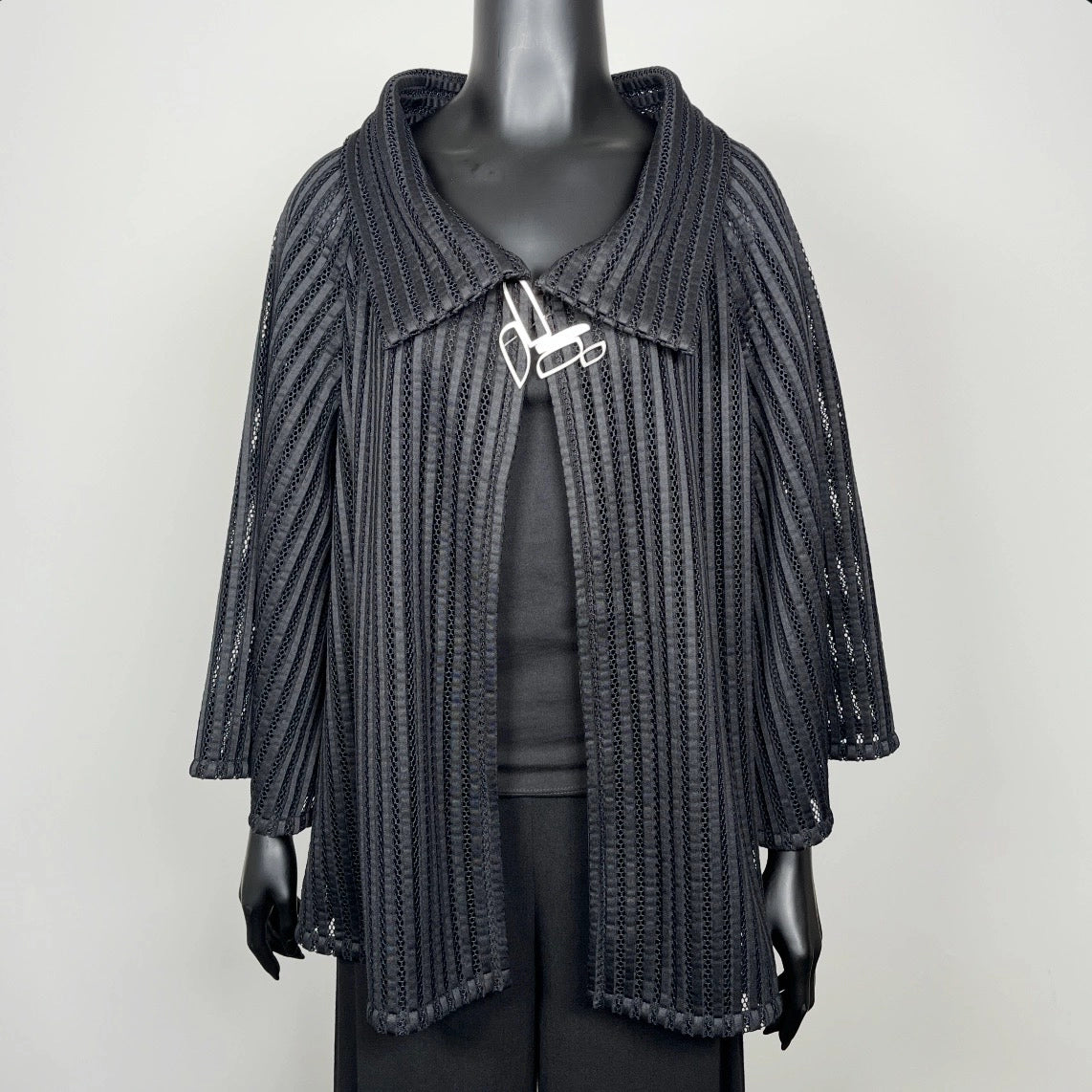 Black mesh coat with high stand up collar and statement silver brooch evening coat event wear unique clothing made in Melbourne Eloise the label
