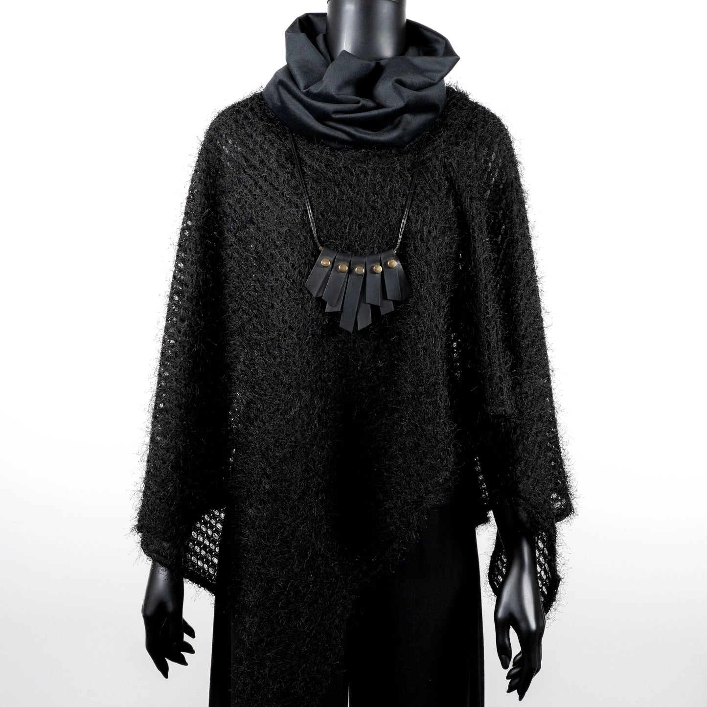 Black knit poncho with soft texture black velvet loop scarf and black rubber necklace made in Melbourne  Eloise the label Australian made 