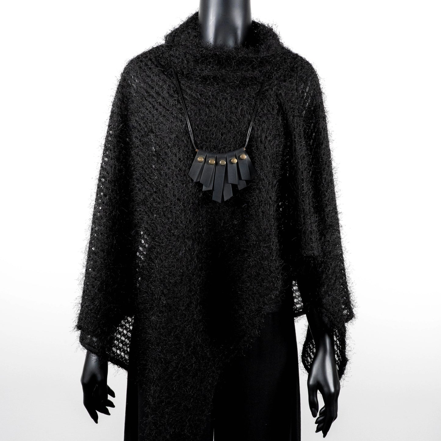 Black knit poncho with soft texture and black rubber necklace made in Melbourne  Eloise the label Australian made 