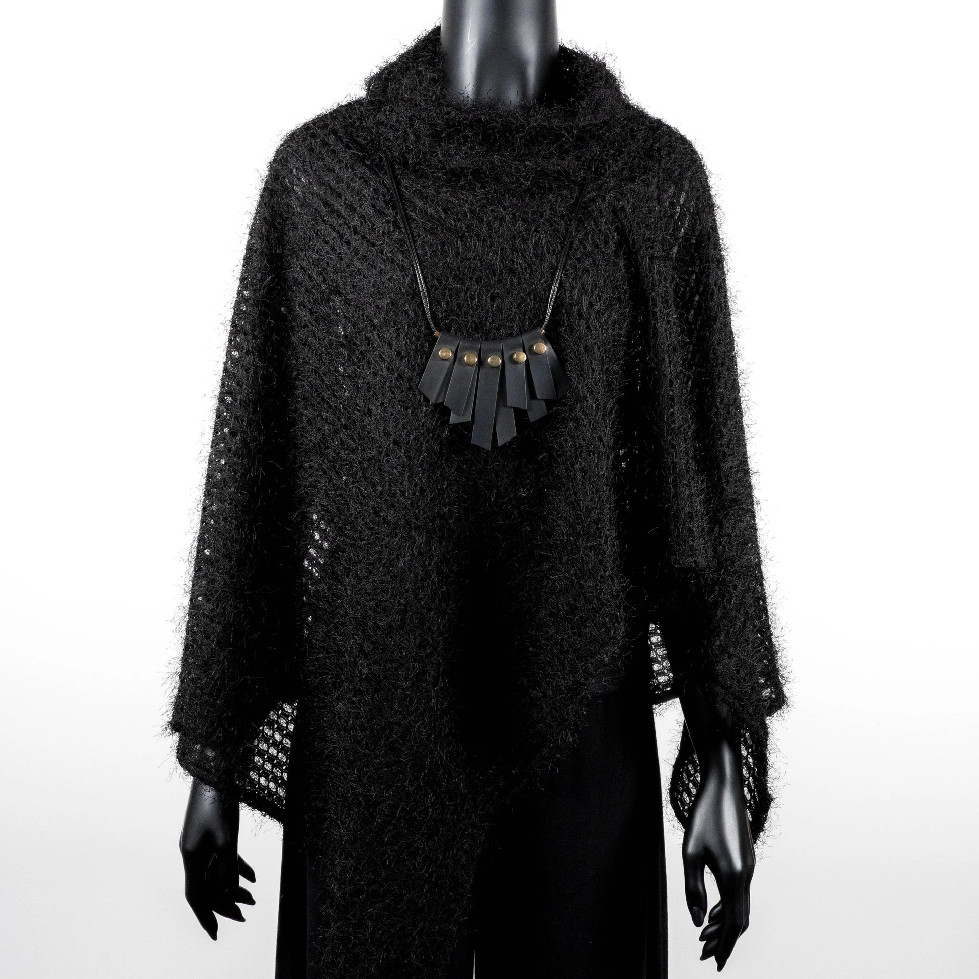 Black knit poncho with soft texture and black rubber necklace made in Melbourne  Eloise the label Australian made 