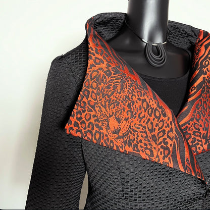 Black jacquard textured jacket with orange and black leopard print patterned collar melbourne made