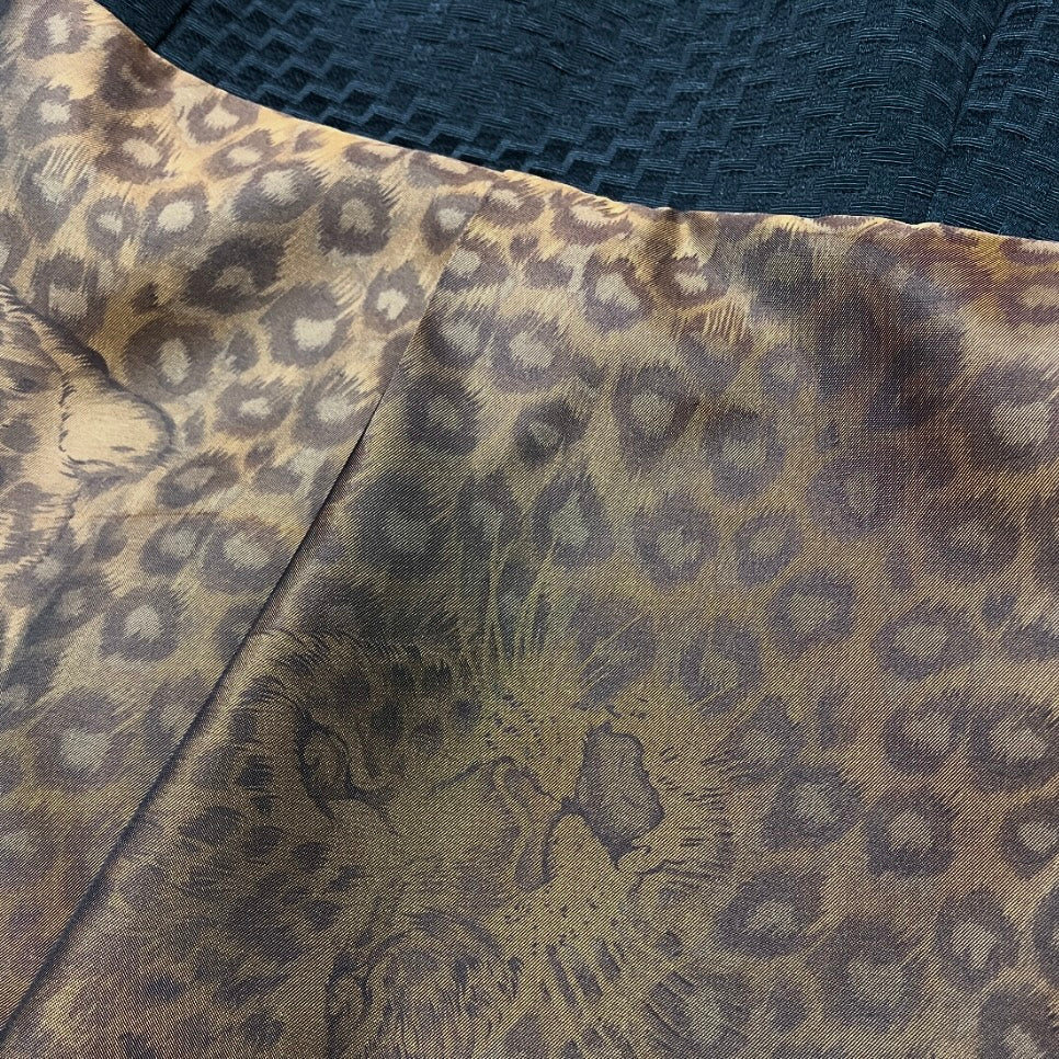 Black jacquard textured jacket with orange and black leopard print patterned collar melbourne made