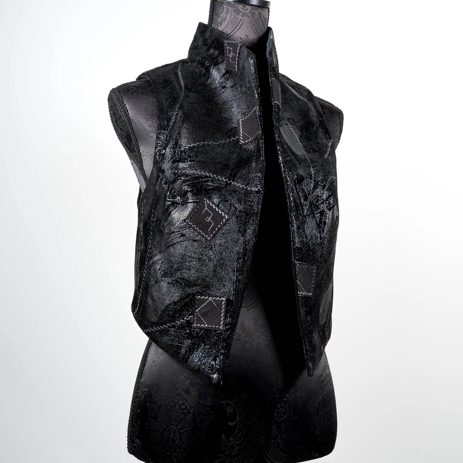Black vest in faux leather and suede with over stitching and patches limited edition gothic style handmade in Melbourne Eloise the label