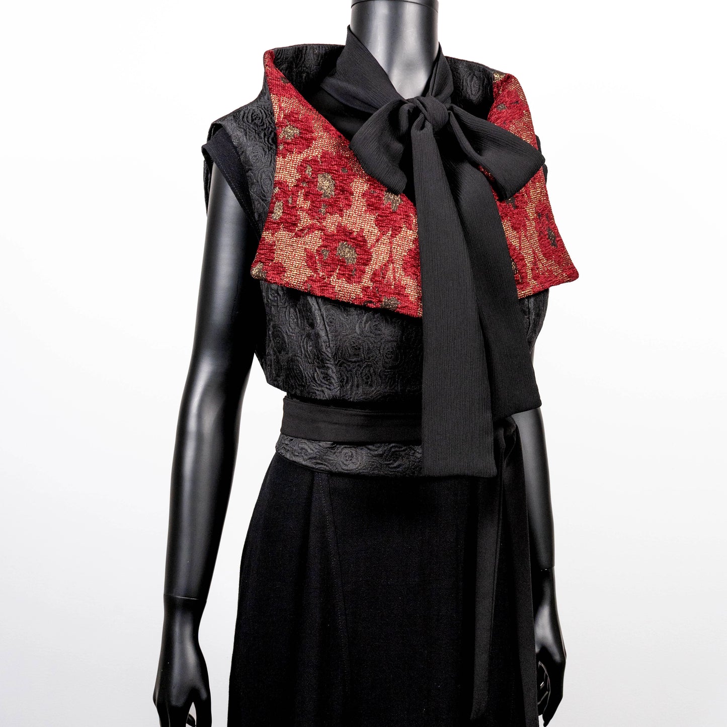 Black floral jacquard vest with burgandy collar high collar and wide lapel black jacquard obi belt made in Melbourne Eloise the label cross necklace black onyx beads pussy bow