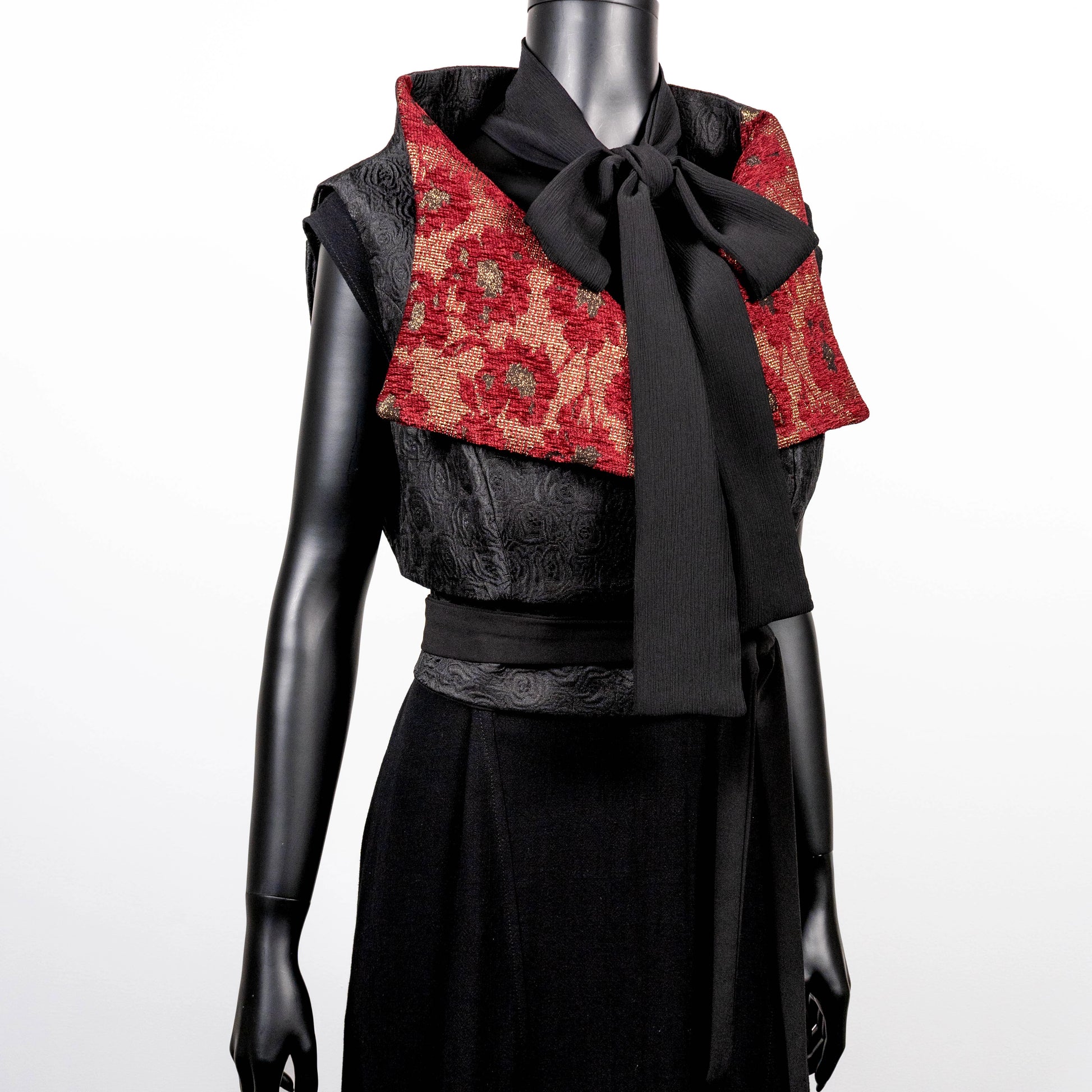 Black floral jacquard vest with burgandy collar high collar and wide lapel black jacquard obi belt made in Melbourne Eloise the label cross necklace black onyx beads pussy bow