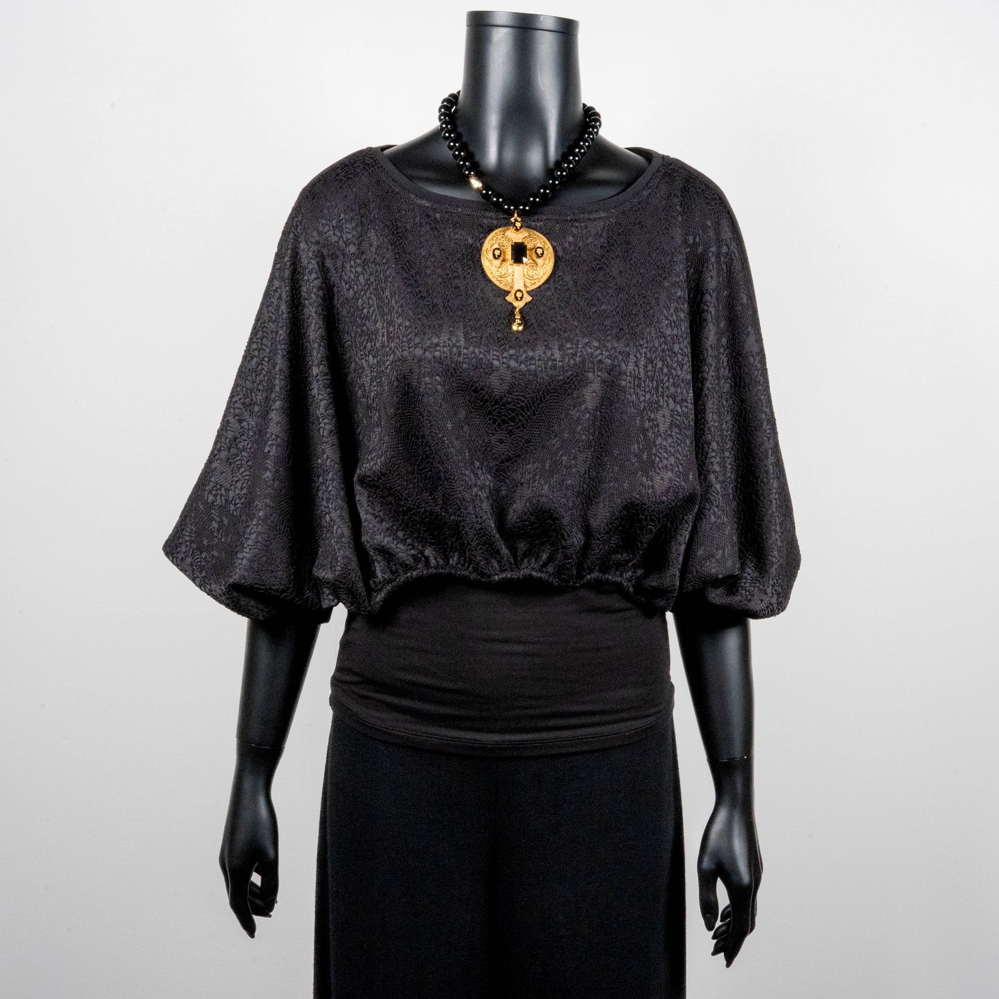 Black bonded lace jacquard top with batwing sleeves gold cross necklace on black onyx beads made in Melbourne Eloise the label