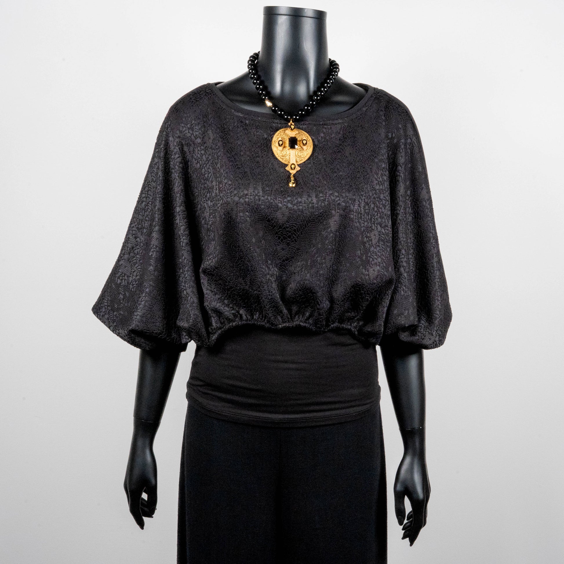 Black bonded lace jacquard top with batwing sleeves gold cross necklace on black onyx beads made in Melbourne Eloise the label
