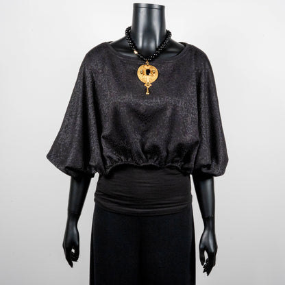 Black bonded lace jacquard top with batwing sleeves gold cross necklace on black onyx beads made in Melbourne Eloise the label