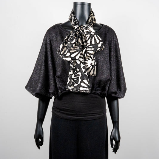 Black bonded lace jacquard top with batwing sleeves layering top gold cross necklace on black onyx beads black and white floral pussy bow made in Melbourne Eloise the label 