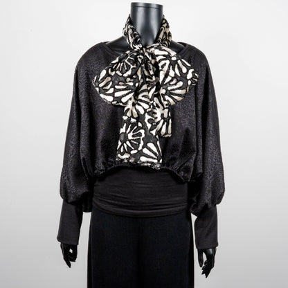 Black bonded lace jacquard top with batwing sleeves layering top gold cross necklace on black onyx beads black and white floral pussy bow made in Melbourne Eloise the label 