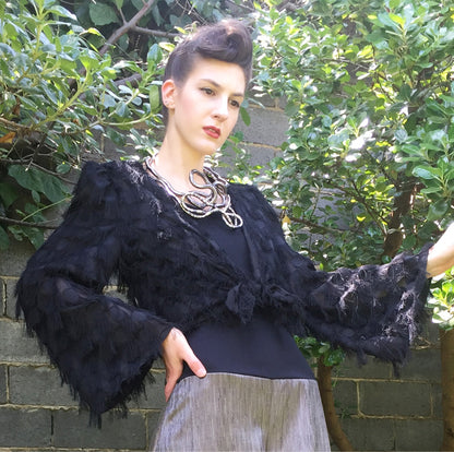 Black tassel fringing top wide bell sleeves and tie front eloise the label